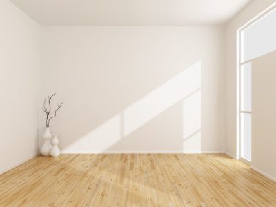 Empty white room with wooden floor and window